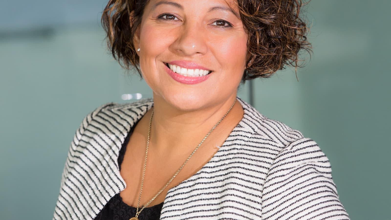 Professional woman headshot with clean studio lighting