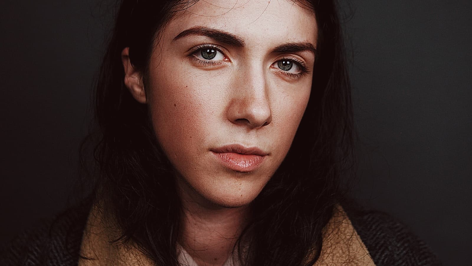 Professional headshot session in studio with controlled lighting