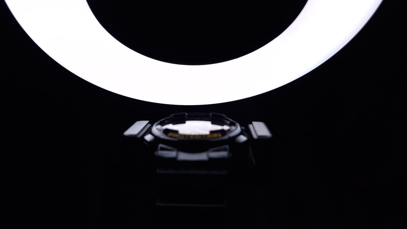 Content creator filming vertical TikTok with phone and ring light