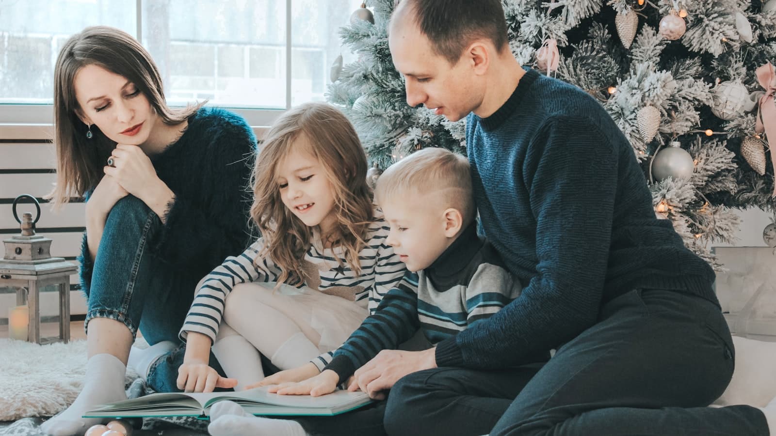 Family in cosy knitwear during a warm festive Christmas studio photoshoot