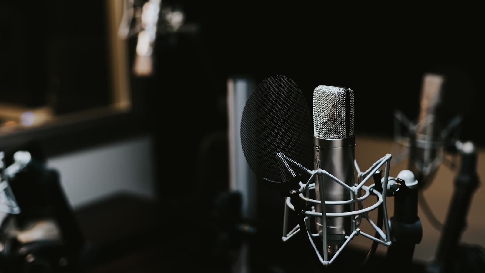 Podcast microphone and recording setup on a studio desk