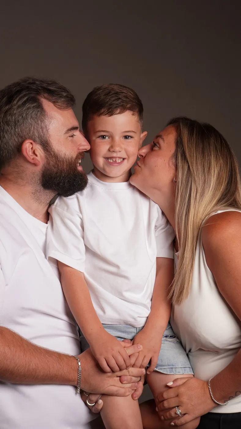 Parents sharing a moment with their son
