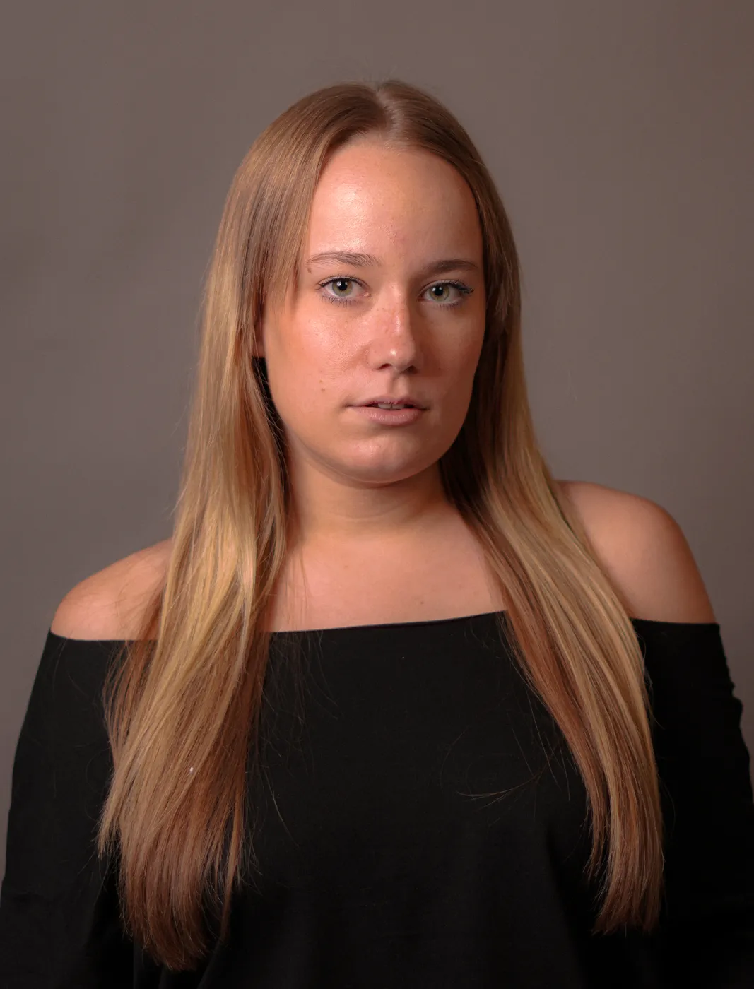 A young woman in a studio portrait